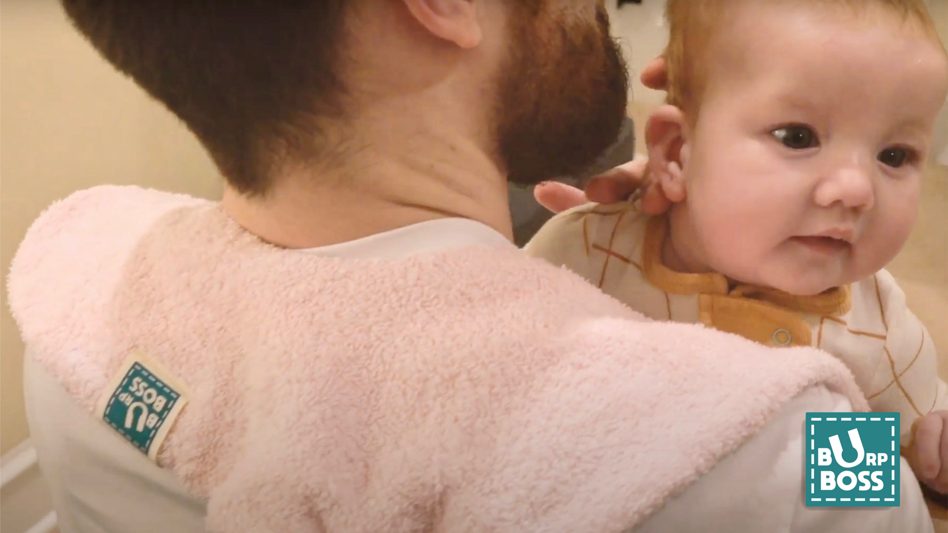 Load video: The burp boss burp cloth being used by a dad and his daughter