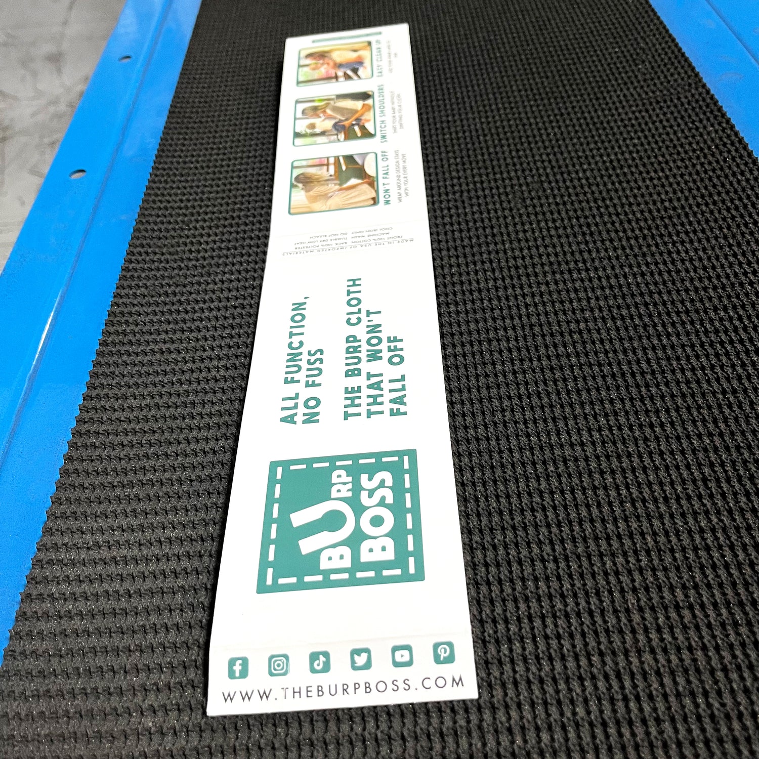 burp cloth packaging sleeve on conveyor belt